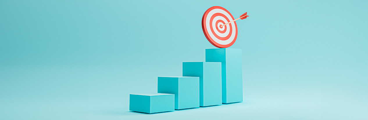 Imagem de um gráfico de barras ascendente com um alvo de dardos no topo, simbolizando o alcance de metas e objetivos de negócios.